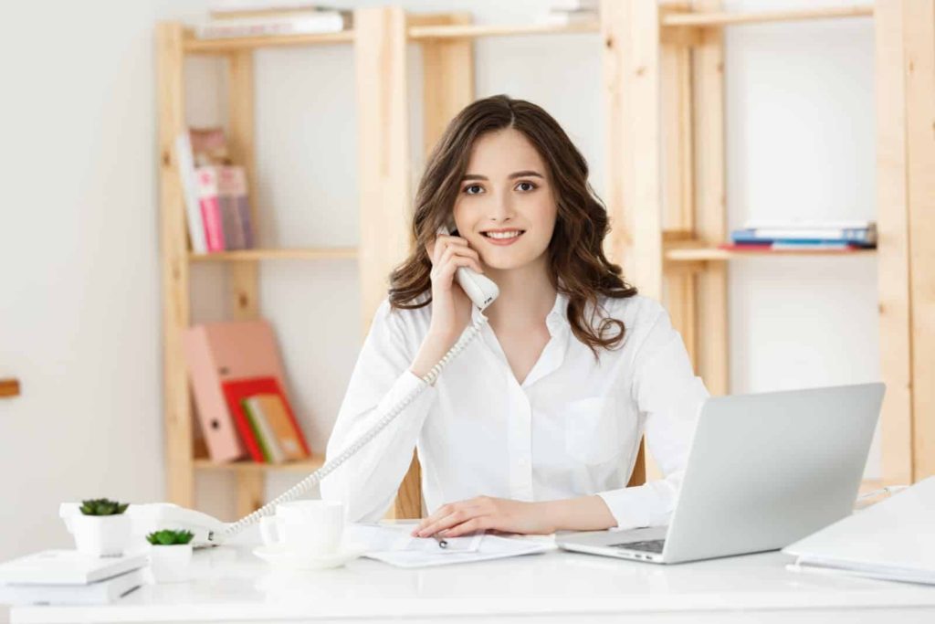 Inventory clerk woman talking on phone inventory services